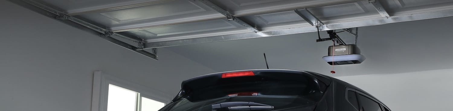 New smart LiftMaster garage door opener installed on a double residential garage door