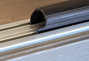Garage door seal or weather stripping that can easily and affordably replaced by a garage door specialist.