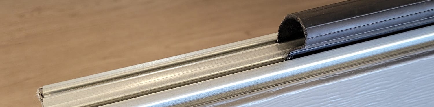 Garage door seal or weather stripping that can easily and affordably replaced by a garage door specialist.