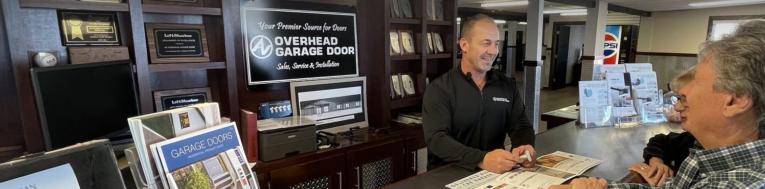 Owner of AV Overhead Garage Door working with customers in the Chicago area showroom