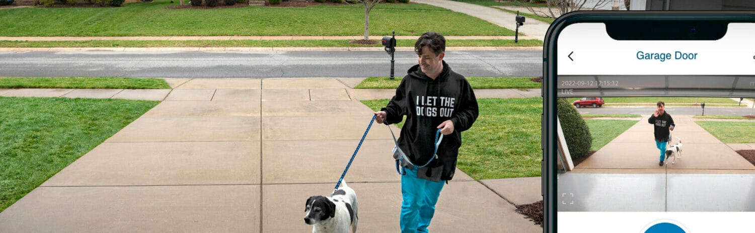 Young male dog walker using the LiftMaster myQ technology to open the homeowner's garage door