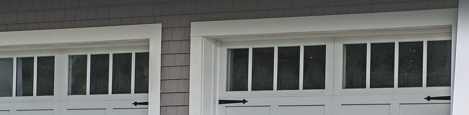 Recent garage door installation service of high quality residential carriage garage doors with Madison windows and ornamental hardware