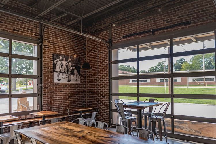 Full-view interior-exterior garage doors in a restaurant, popular doors for many venues