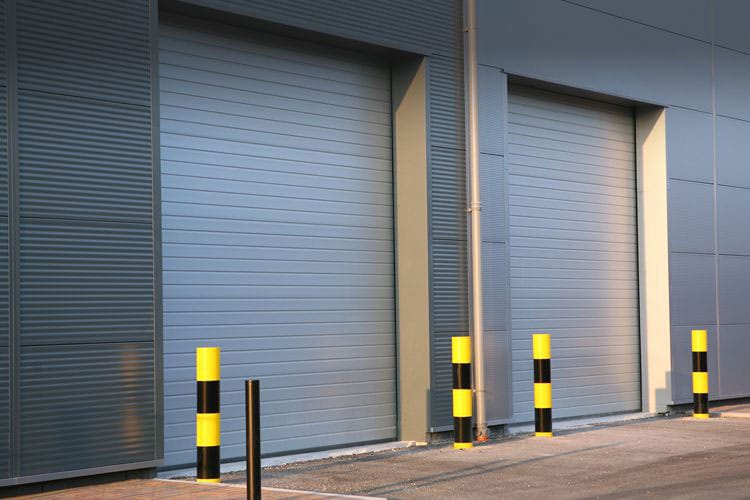 New commercial overhead section doors on a business facility